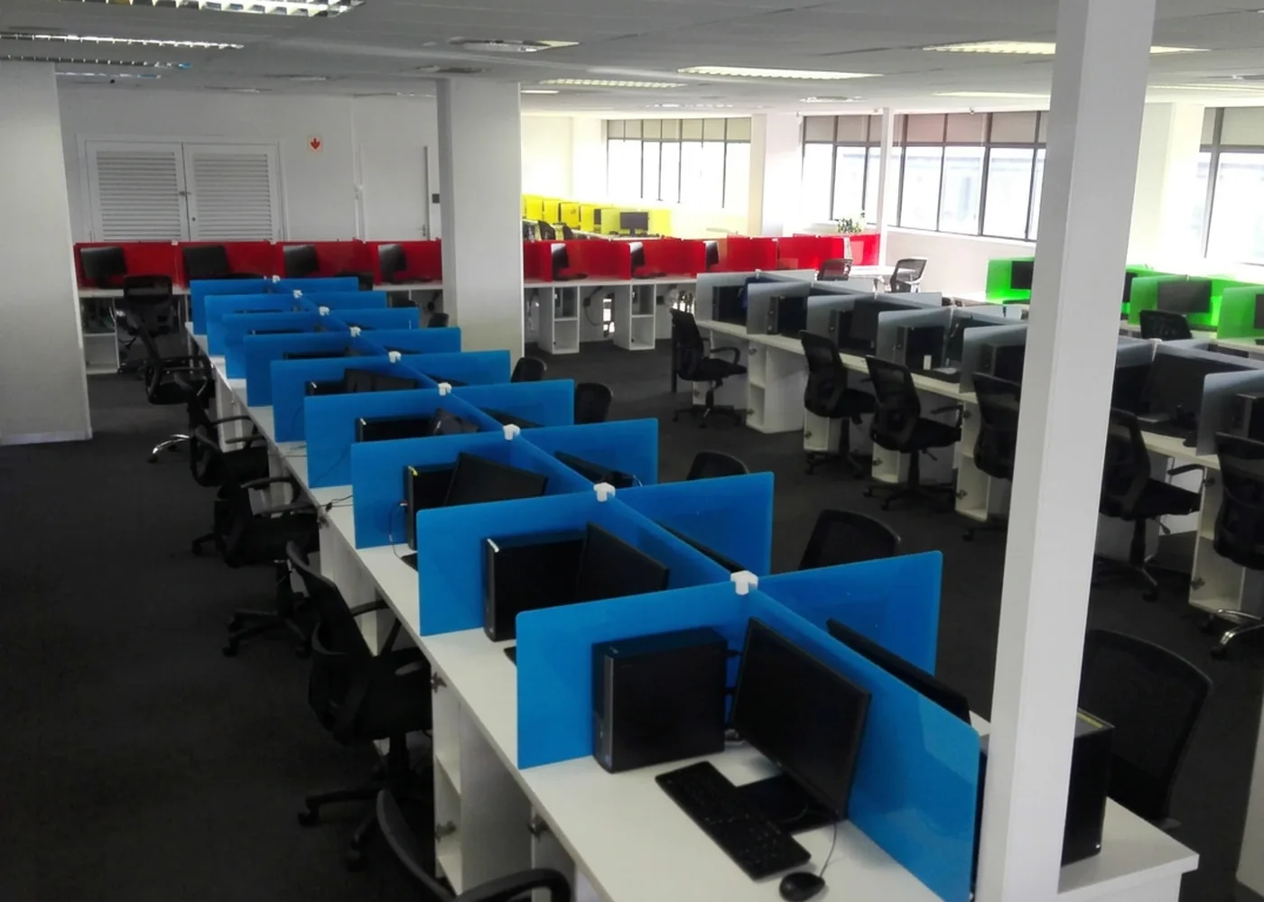 Usured operations floor — rows of fitted workstations